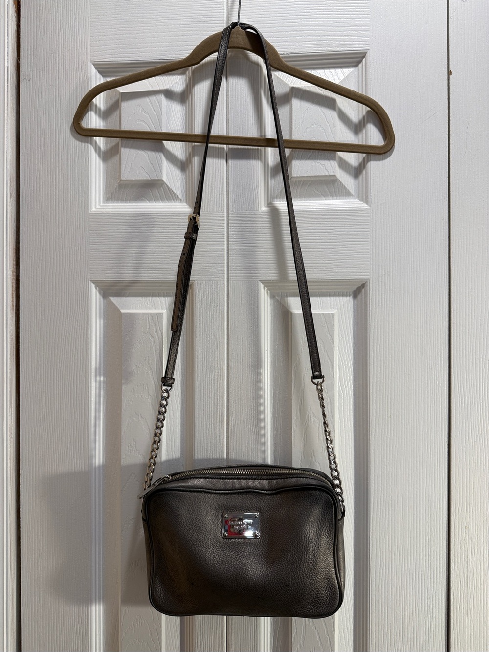 Michael Kors Pebbled Black Leather Crossbody with Silver Plaque